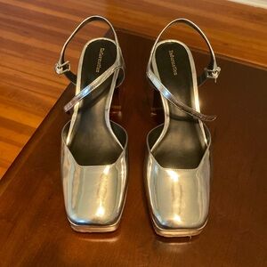 Silver Reformation platform shoes, size 9.